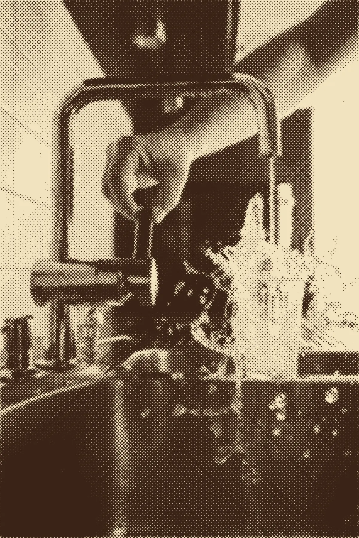 A hand turning on a kitchen faucet, water splashing into the sink