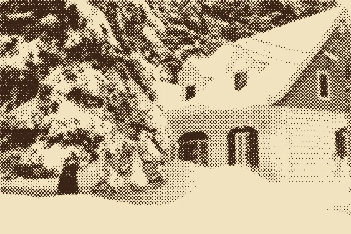 A blue and white house covered in deep snow