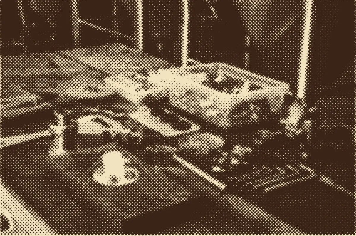 Plumbing tools and fittings laid out on a wooden workbench