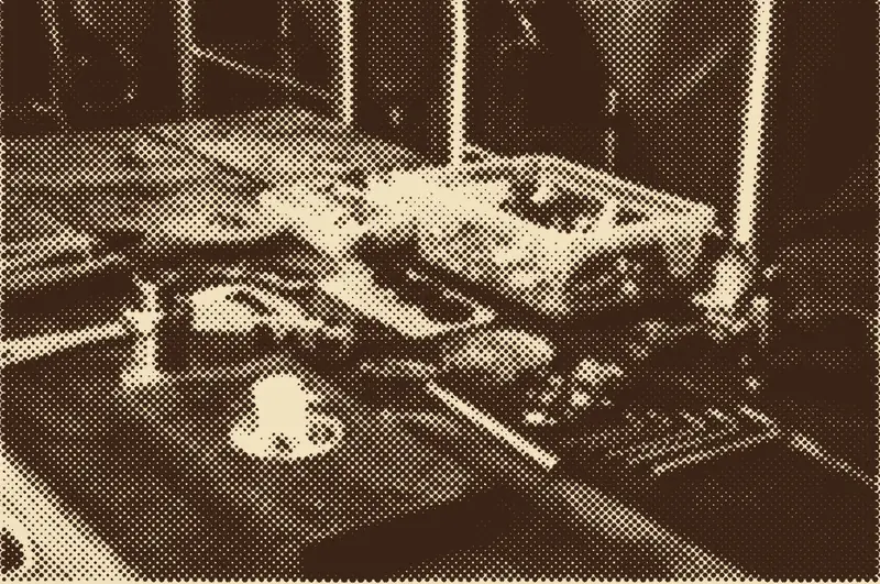 Plumbing tools laid out on a workbench, printed as a halftone