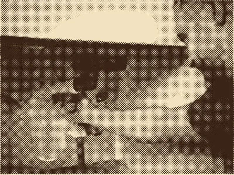 A Calder plumber working on pipes under a sink, printed as a halftone